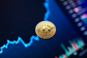 Gold Bitcoin Coin On Background Of Growth Chart