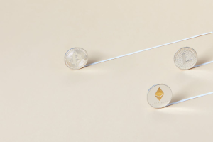 Photo of NFT Coins on a Beige Surface