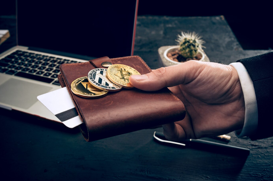 a man holding golden coins