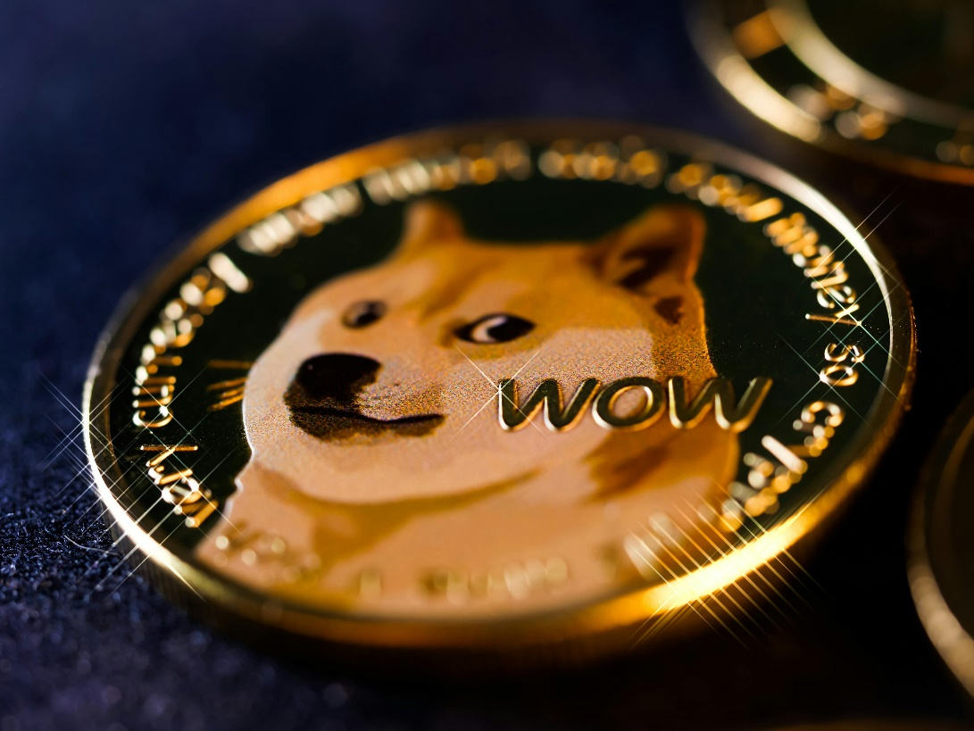 A close-up shot of a gold-colored Dogecoin.