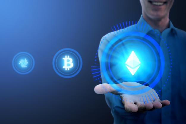 A person holding a glowing Ethereum symbol in their hand, with Bitcoin and other cryptocurrency icons in the background.