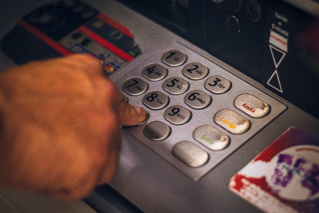 A person using an ATM.