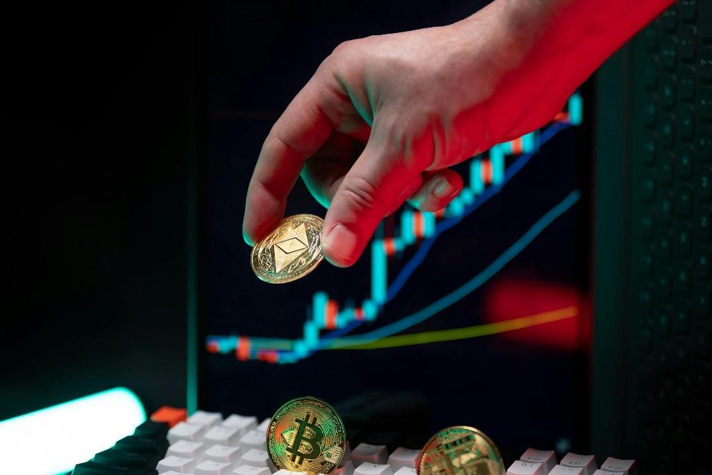 Hand holding a cryptocurrency coin over a financial chart representing blockchain-based private credit