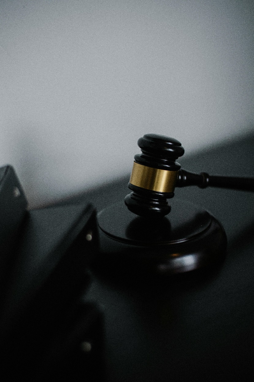 Wooden gavel on a desk, symbolizing legal decisions and regulatory actions in digital assets.