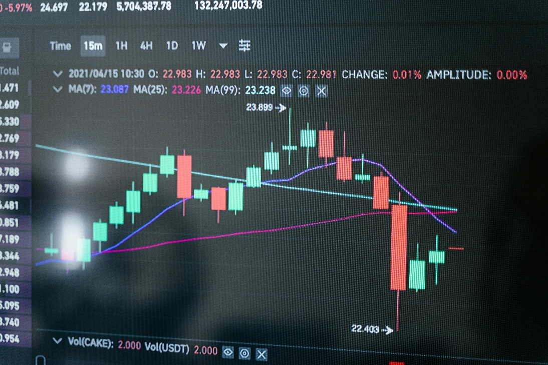 Analyzing digital asset investment accounts on a laptop