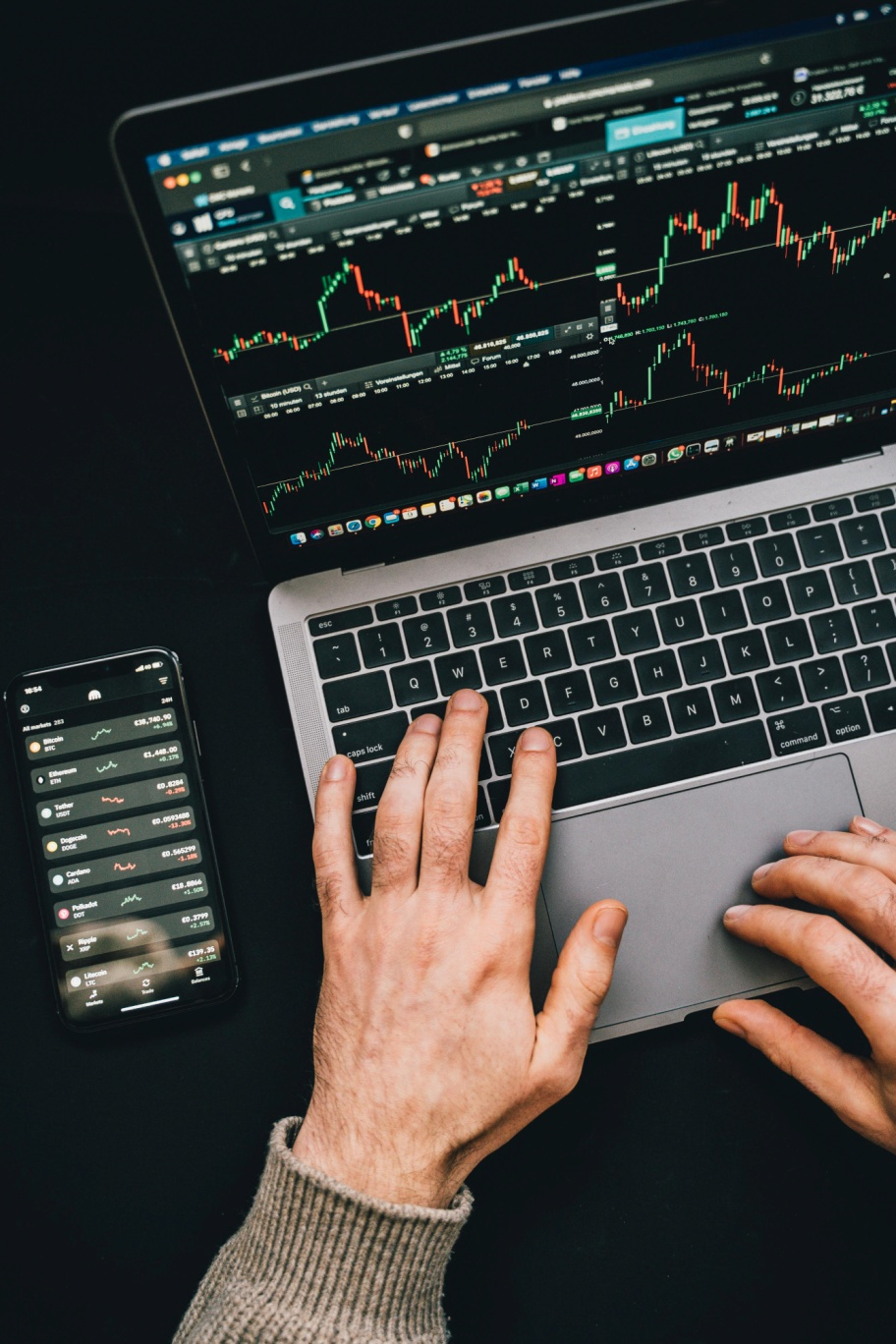 Individual analyzing digital asset strategy on a laptop