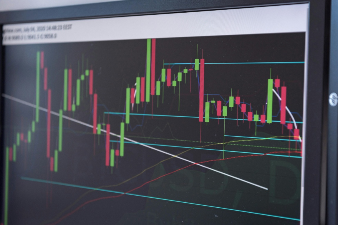 Close-up of a crypto price chart on a monitor showing market activity