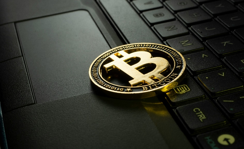 Silver and black cryptocurrency emblem.