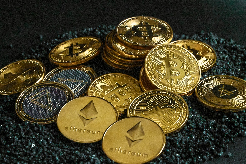 A pile of bitcoins resting on gravel.