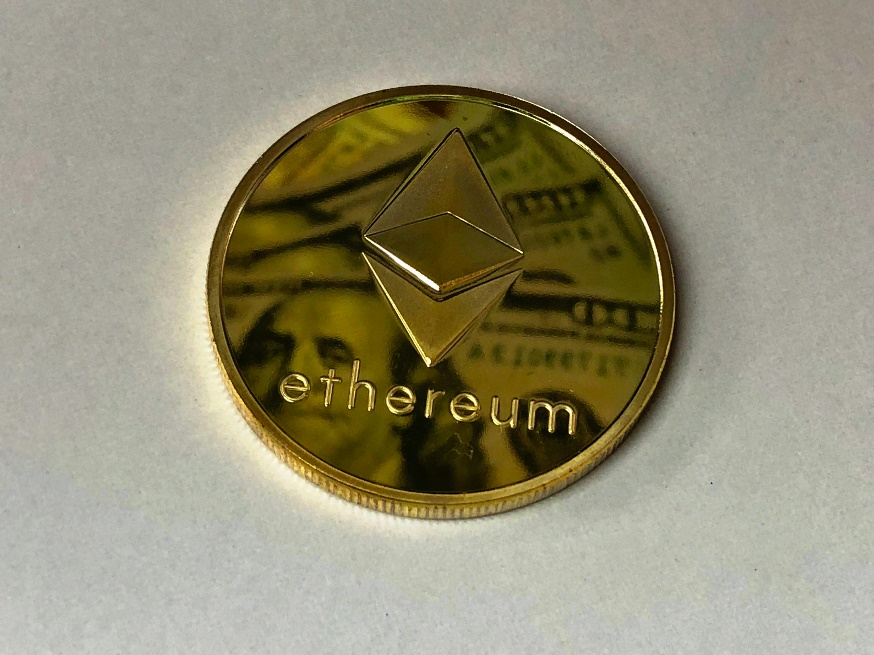 Close-up of a gold-colored Ethereum ornament.