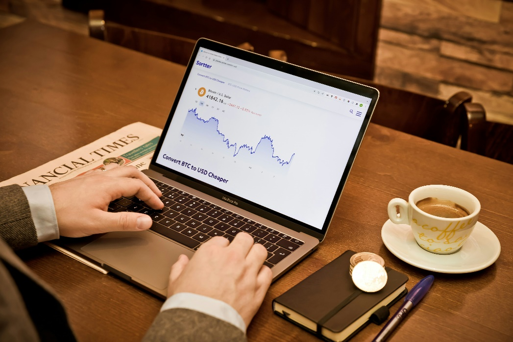 Professional analyzing digital asset yield strategies on a laptop