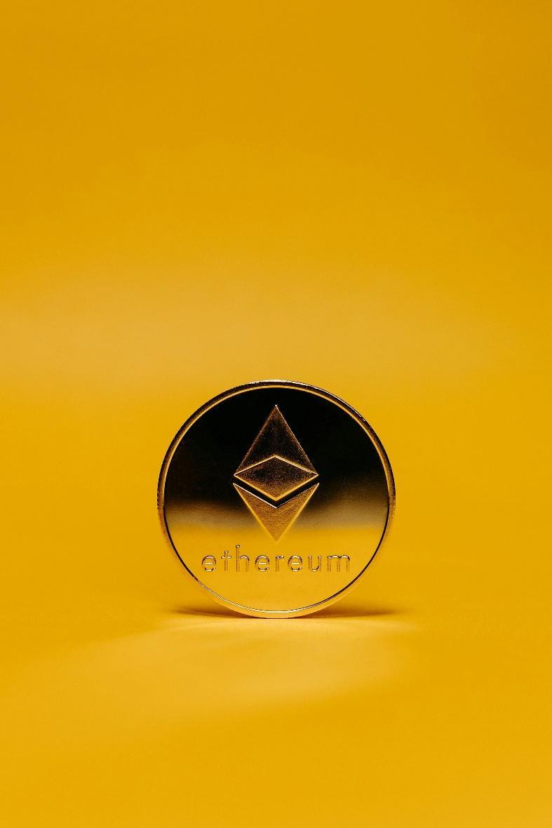 Ethereum coin on yellow background symbolizing smart contracts and AMM protocols in DeFi