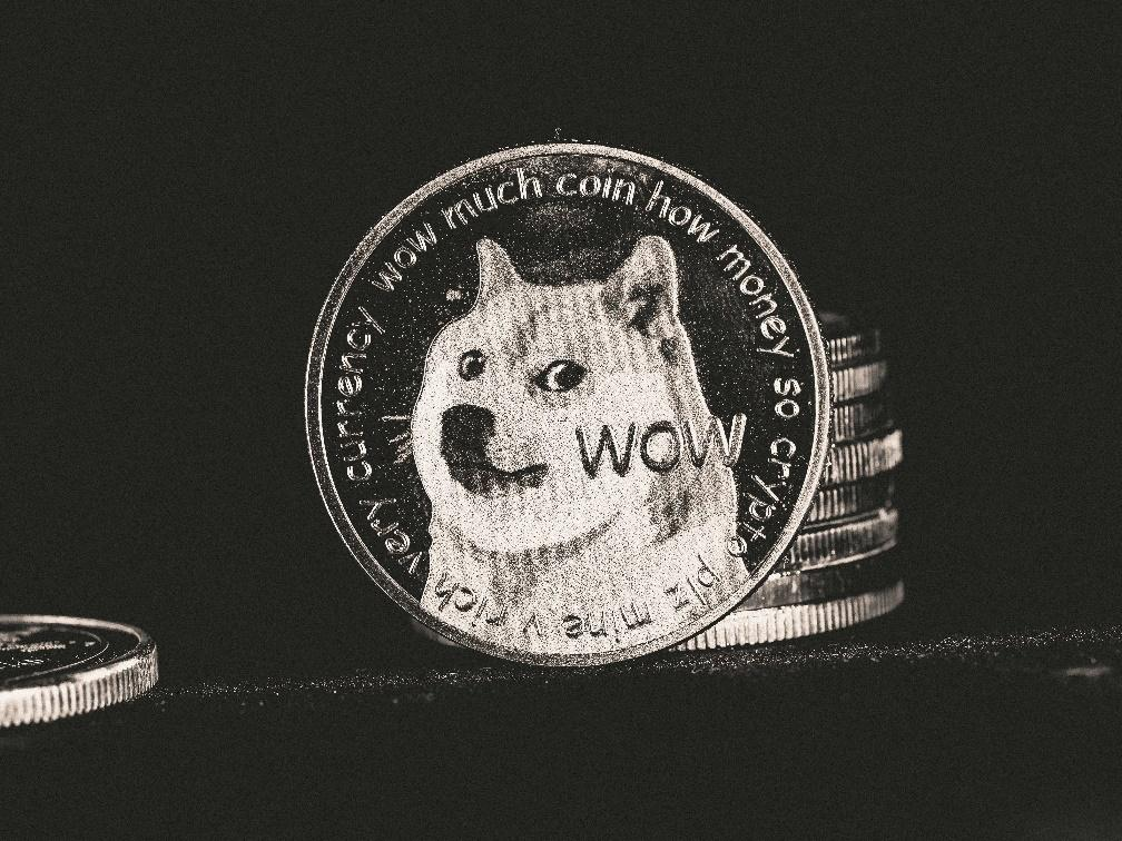 A physical Dogecoin, representing the broader memecoin market.