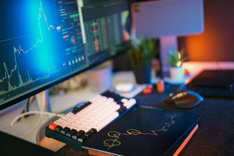 Dynamic workspace with multiple screens showing cryptocurrency market analysis charts and graphs.