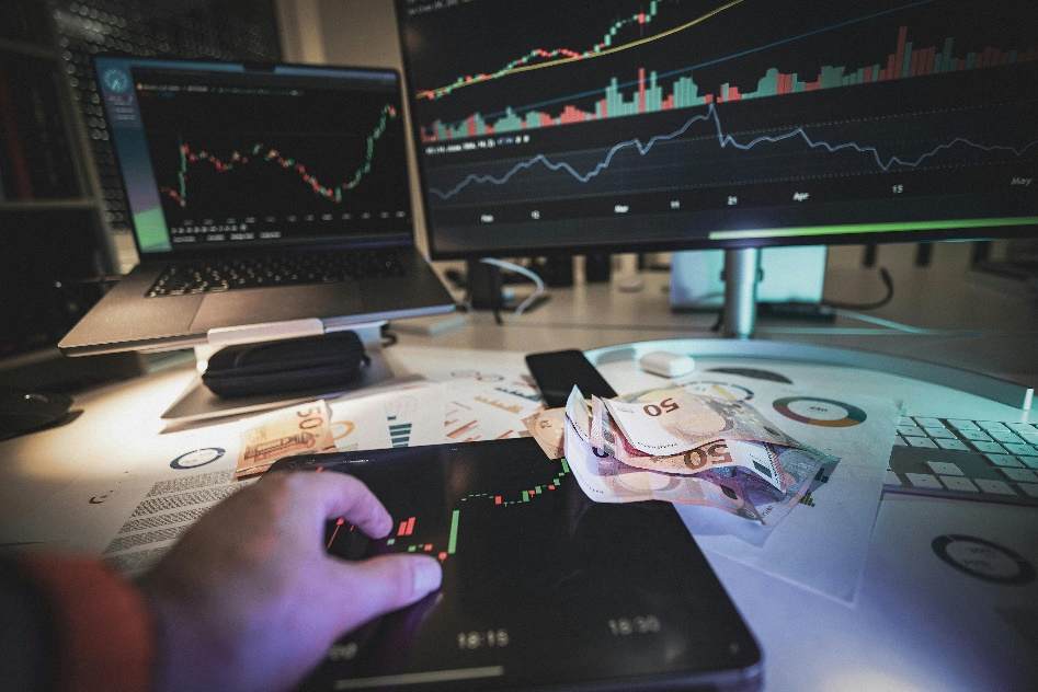Hand reviewing financial data and Euro currency, symbolizing blockchain and institutional upgrades