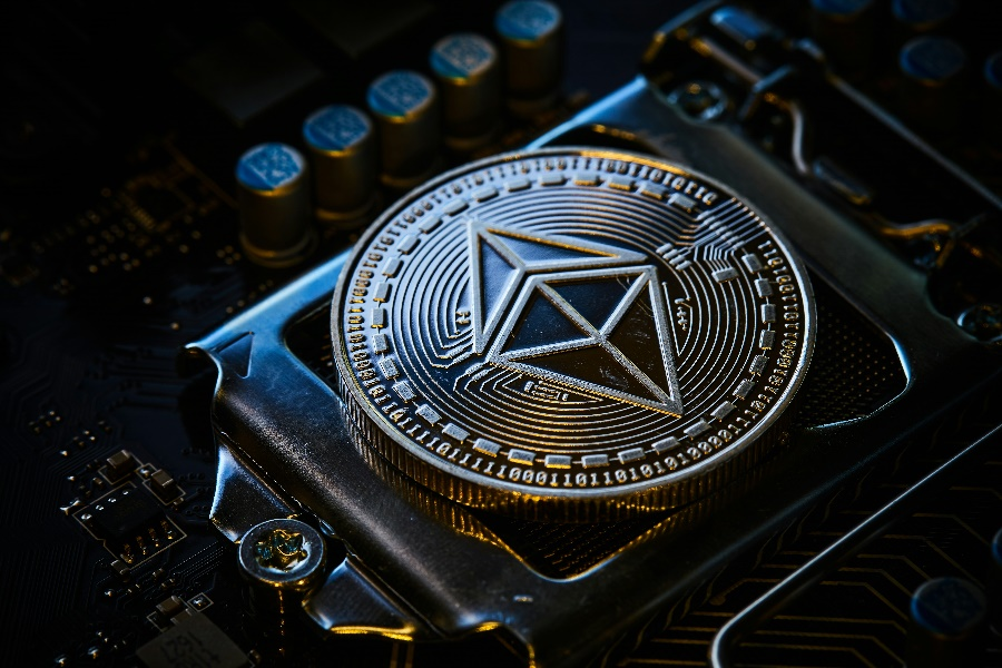A silver Ethereum cryptocurrency coin.