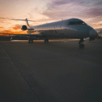 Commercial aircraft on runway at sunset, representing tokenized aviation leasing opportunities