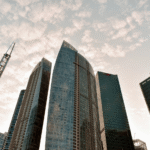 Glass skyscrapers representing institutional finance and digital asset infrastructure