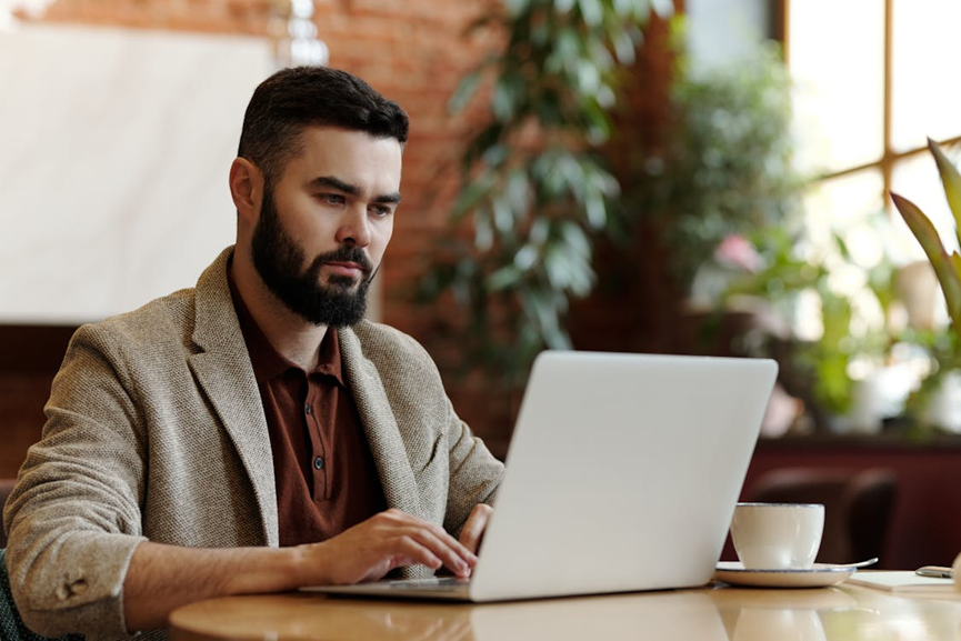 digital asset consultant using a laptop for advanced analytics, blockchain insights, and market trend interpretation.