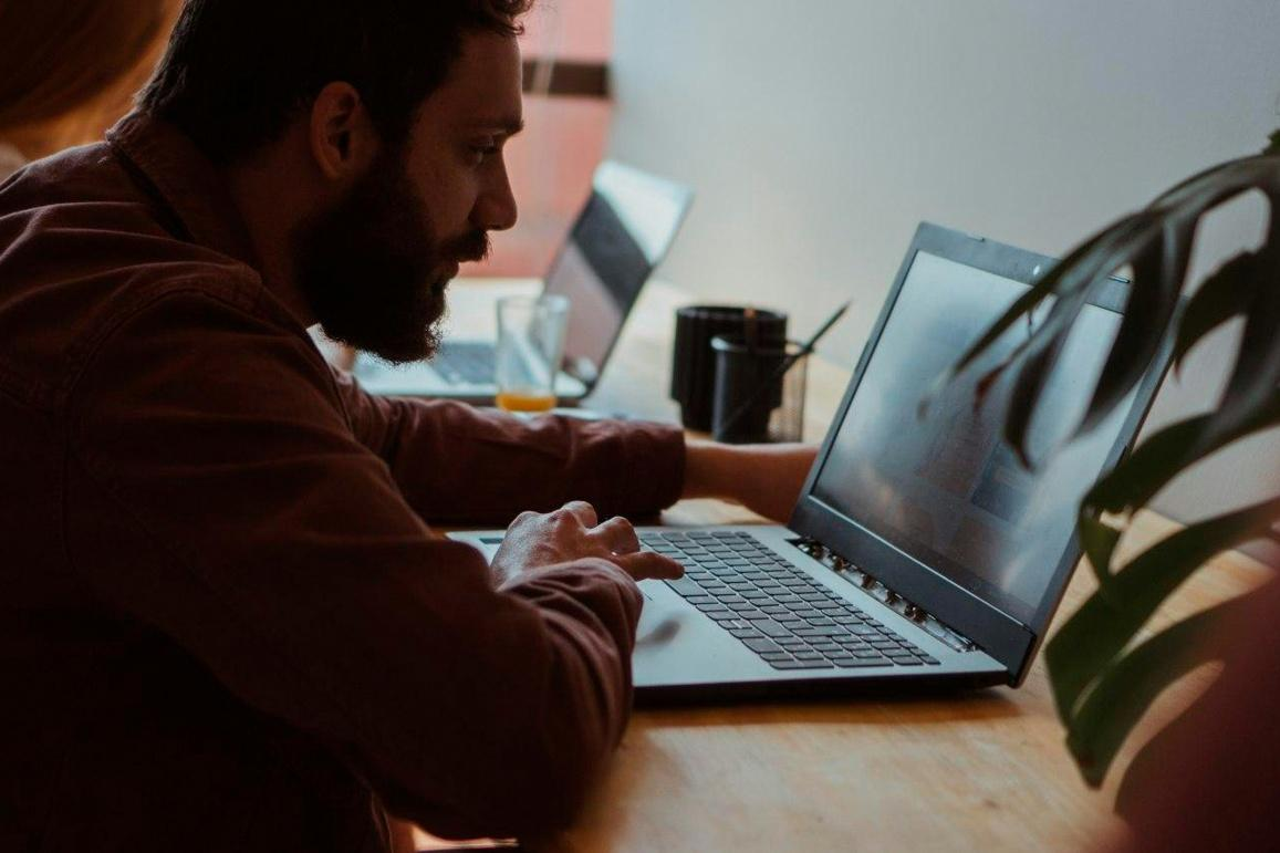 Analyst reviewing digital asset data and transaction activity on a laptop.