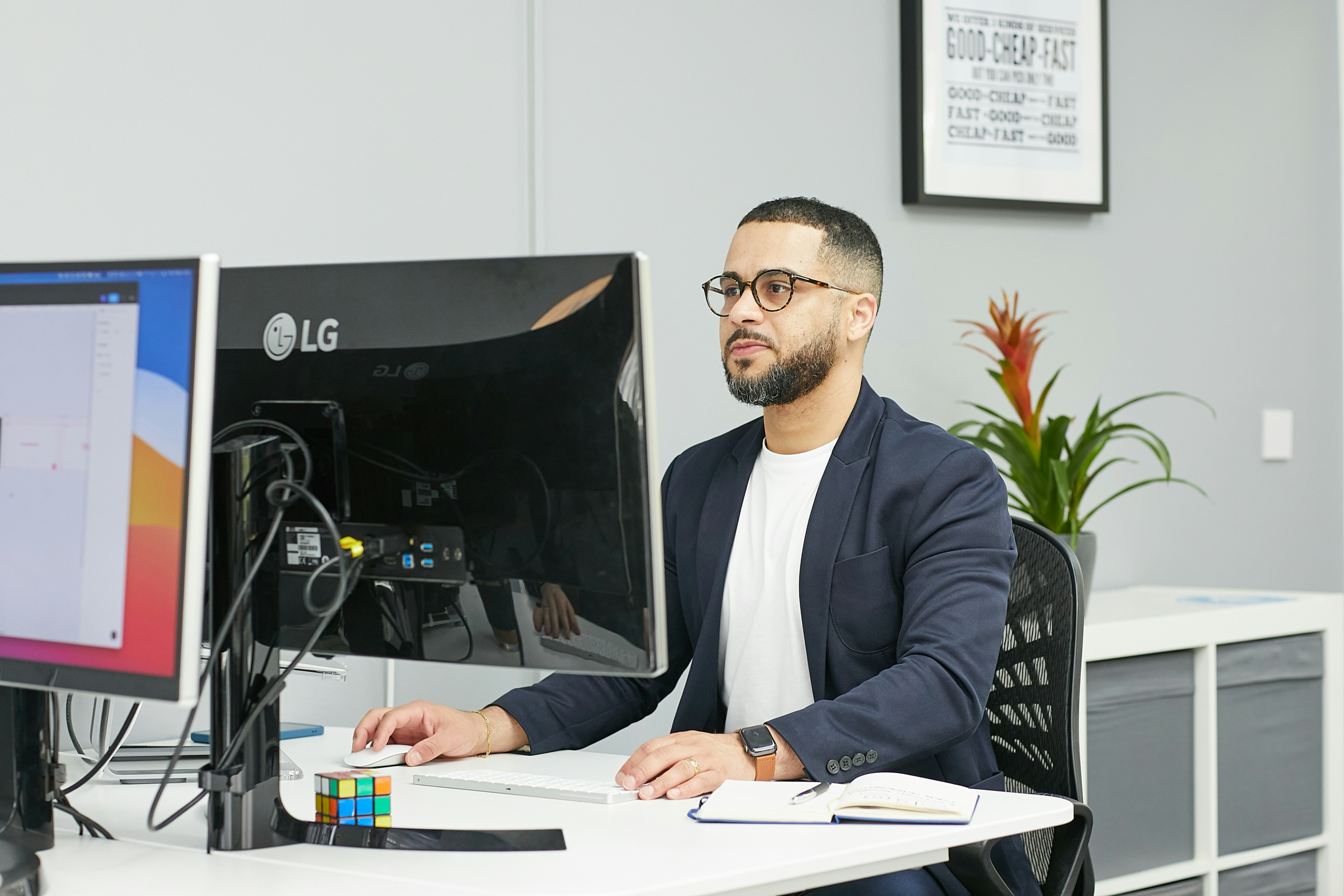 Financial analyst reviewing digital asset data and charts on a desktop workstation while monitoring market activity and portfolio performance.
